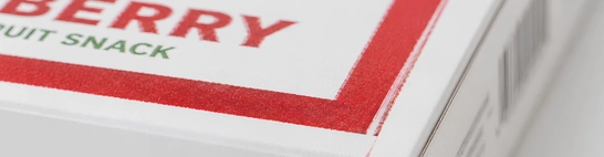 Misregistered printing, blurred text or artwork trimmed off the edge