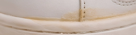 Glue residue, marks or stains visible on the finished shoe